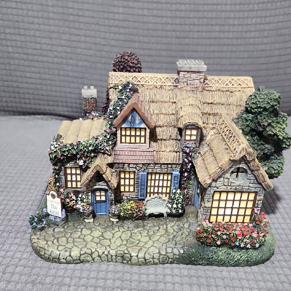 Charming Cottage Figurine with Floral Details